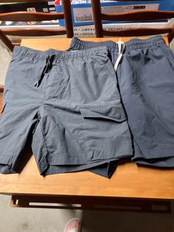 Two pairs young men shirts size medium nwt