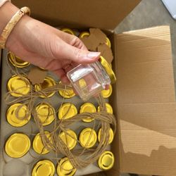 box of tiny jars
