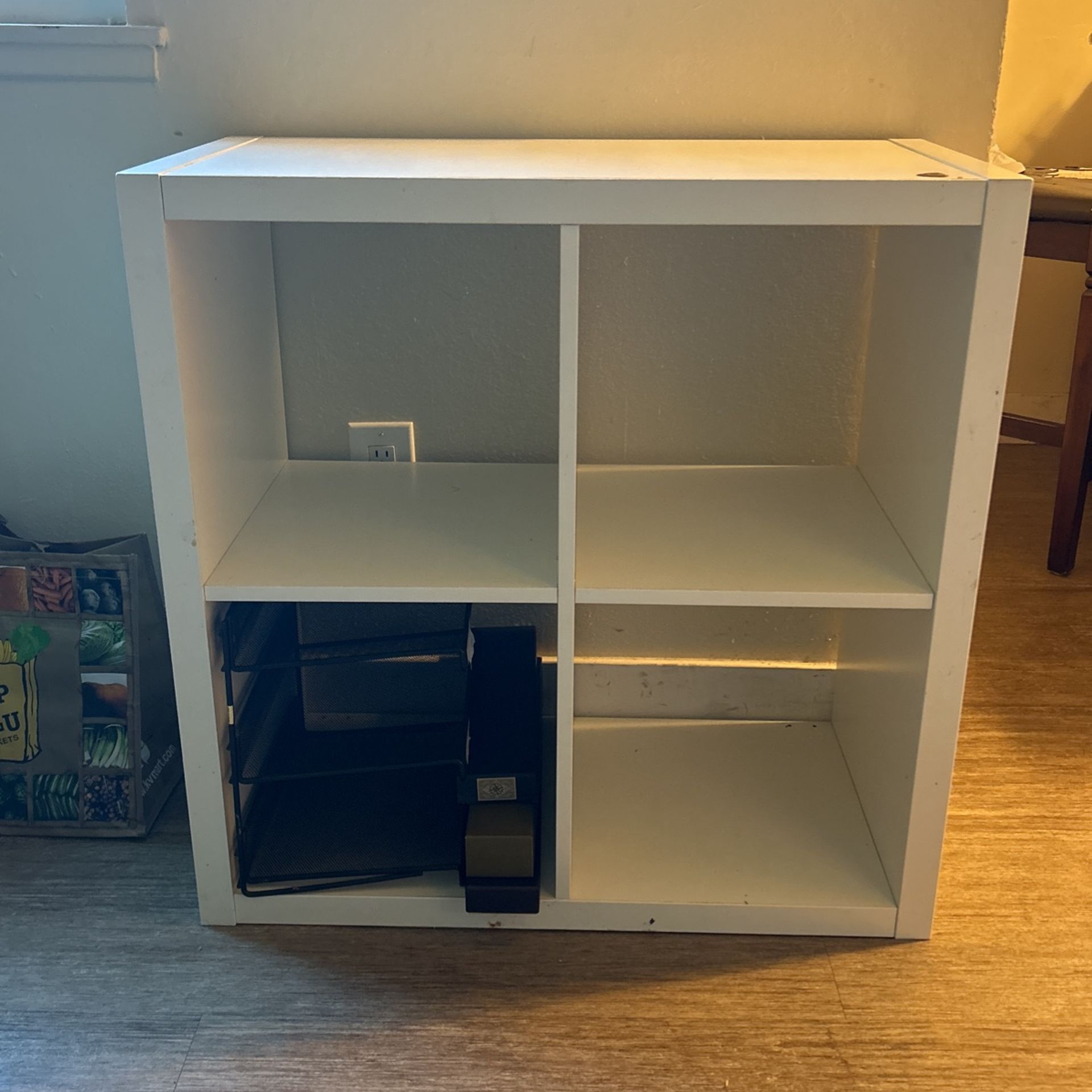 white shelf with four openings