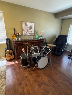 Drum set (8 piece set) plus drumsticks, chair, pedal etc.