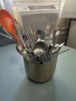 Silver Utensil Holder Full Of Utensils 