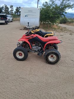 2004 Honda 250EX red one 2002 Honda EX yellow one