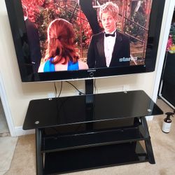 47 samsung TV and 3 glass table stand