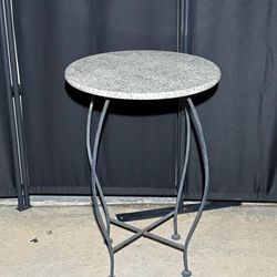 16”x23” wrought iron plant stand or side table with a stone top.