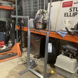 Used four arm clothing rack (but only has two arms as shown)