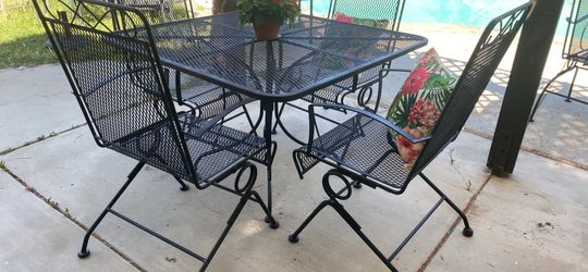Vintage wrought iron with rocking chairs table size 42”x42 inches and 28” tall
