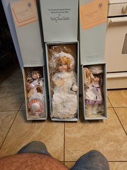 MUSICAL PORCELAIN DOLLS  MUST SELL