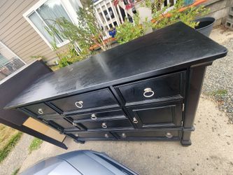 PENDING CONFIRMATION FOR PICKUP Ashley Black Wood Dresser with Silver Ring Pulls
