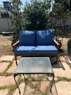 Patio loveseat with new cushions and table