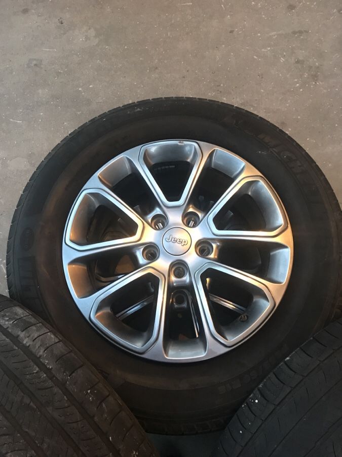 Jeep Grand Cherokee stock wheels. Rims are good just gonna need tires pretty soon.