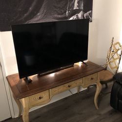 Tv An Antique Dresser Table With Chair