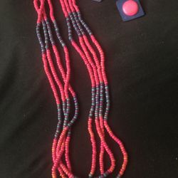 Fuchsia beaded necklace with stations of dark turquoise beads and earrings