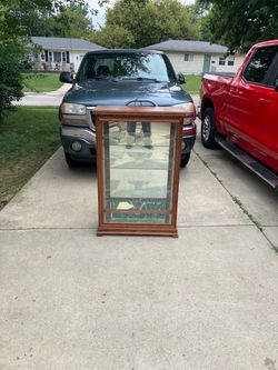 Small lighted curio cabinet