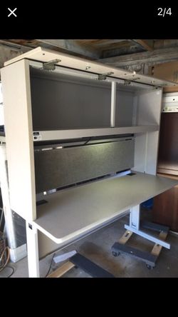 Office desk with lights and pegboard