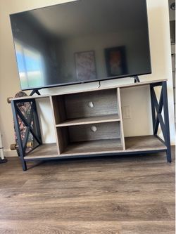 Wood and black TV stand L 47”  W 16” H 24”