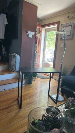 Small wood and metal desk and floor lamp good for small spaces
