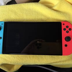 Nintendo Switch OLED With Mario Kart 8 Deluxe Splatoon3 And Super Smash Bros Ultimate Street Fighter Anniversary Collection And NBA2k22