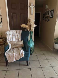 Teal Blue Wingback Accent Chair and big teal vase
