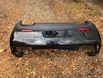 Rear bumper cover rear molding with wire harness