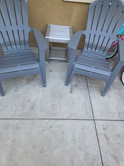 Adirondack plastic grey chairs and aluminum side table
