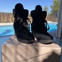Woman’s Black Wedge Heeled Booties