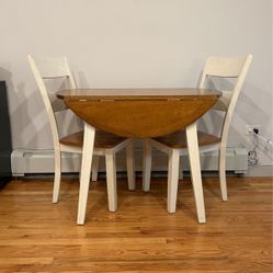 Solid Wood Table With Drop Leaves And Two Chairs