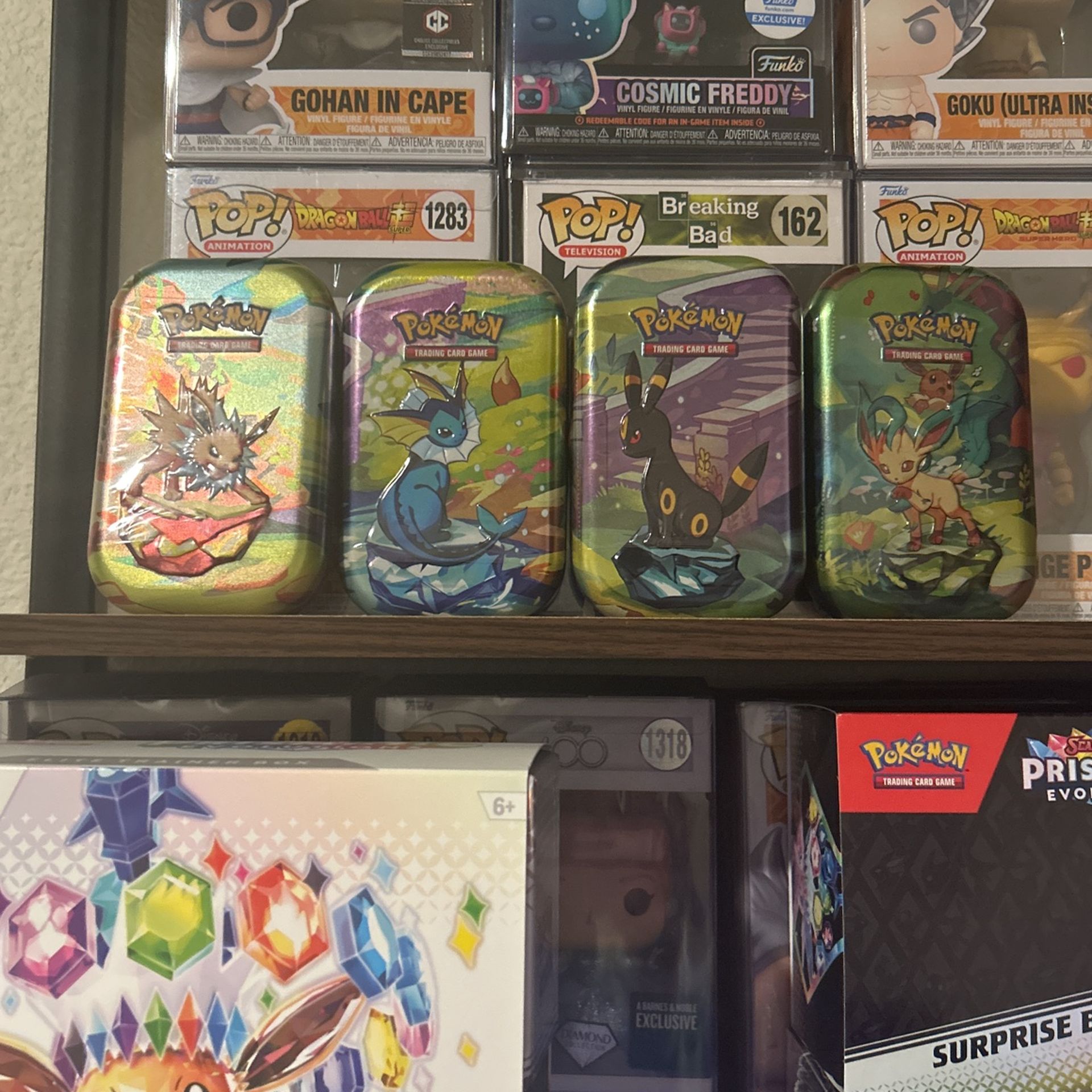 Pokémon Prismatic Evolutions Mini Tin