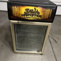 Java monster coffee energy rare mini fridge  Used some scratches from normal use please check all the pictures  Meserment:  High: 33” Wide: 20” Deep: 