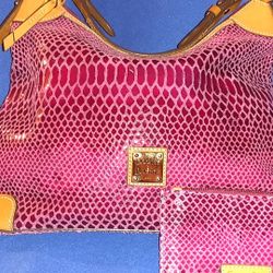 This a pinkish color snake enbosed hobo bag