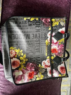 Steve Madden Bsidra black floral tote bag.