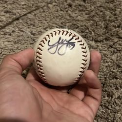 A Joe Musgrove and Orbit autographed baseball