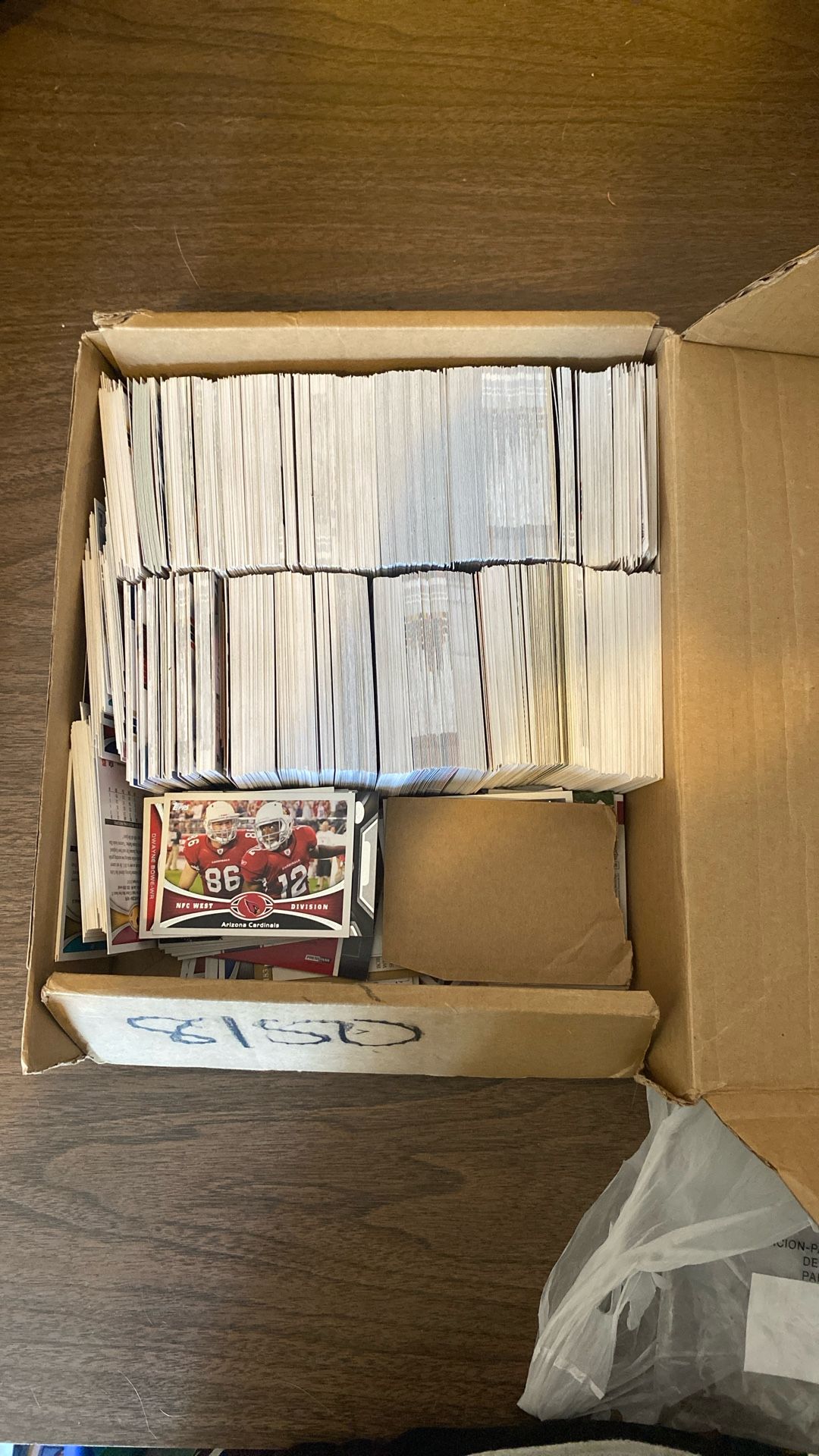 Box Of Baseball And Football Cards.