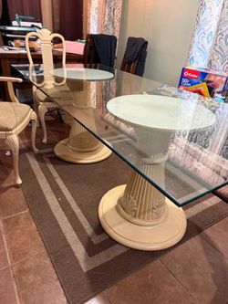 Glass Dining Room Table, 6 chairs with leopard print  seat cushions.