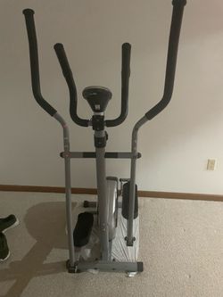 This is a grey Sunny Health & Fitness elliptical trainer.