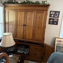 2 large Storage Cabinet The Bottom Is Also A Desk. It Isn't Two Pieces. It Is 6 Feet Tall And 4 Feet Long Ready To Sell It Today.