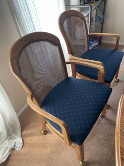 4 Dining chairs with Arm on wheels
