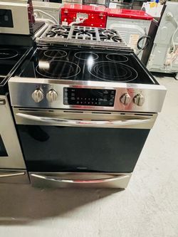 Frigidaire stainless steel electric stove—includes a receipt for a 90-day warranty.