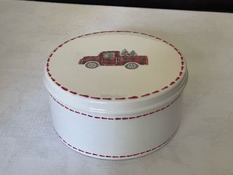 North Pole Modern ceramic holiday Christmas cookie canister featuring a red plaid truck design.