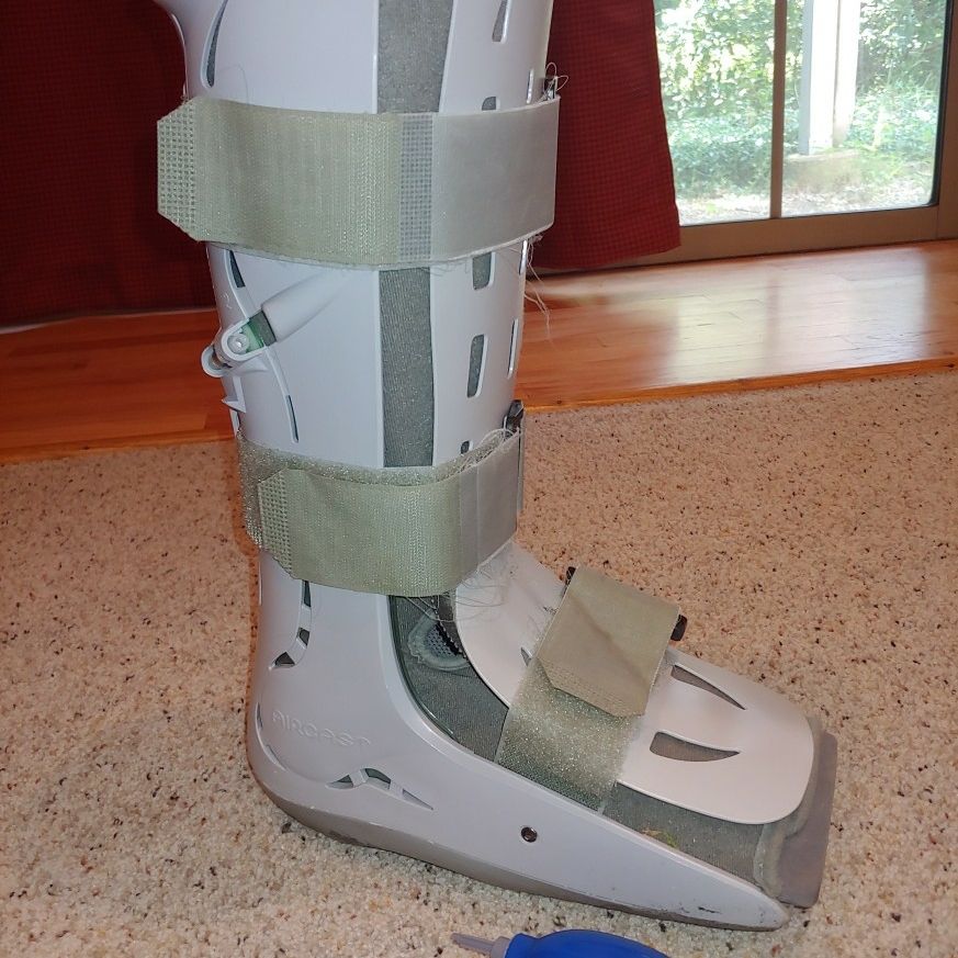 Air cast walking boot with air pump knee high