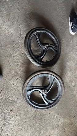Two mongoose bike wheels