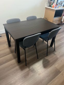 Dark brown dinning table and chairs.