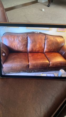Brown Leather Sofa with Carved Wood Frame