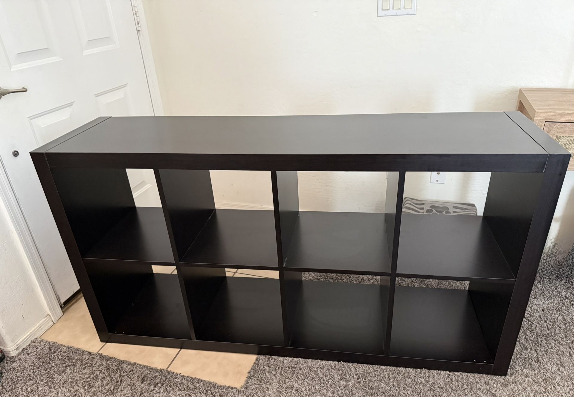 IKEA Kallax shelf unit in black-brown. Used