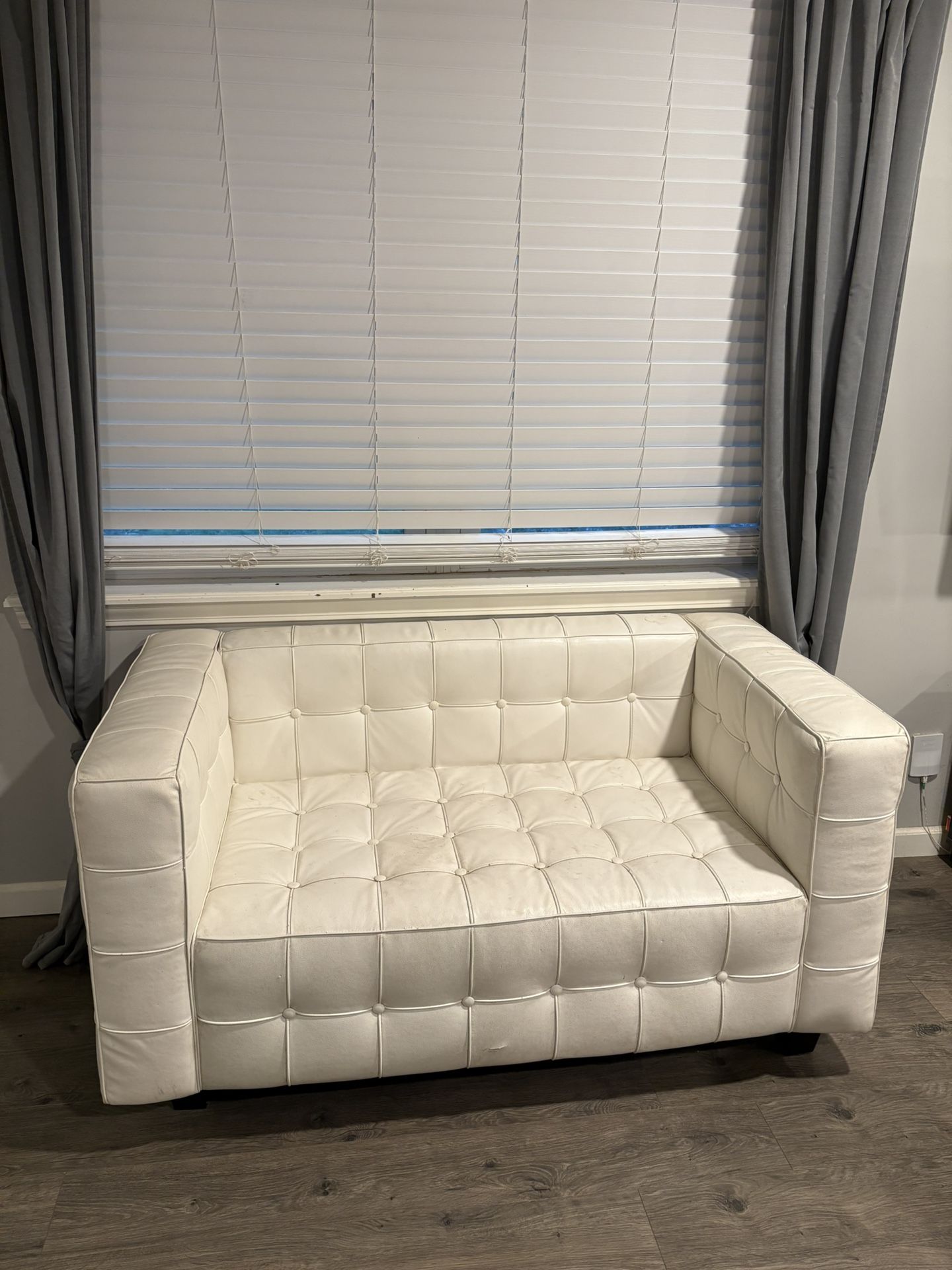 White faux leather small couch