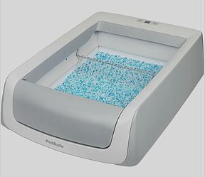 Petsafe automatic ScoopFree litter box along with 3 large boxes of refill trays.