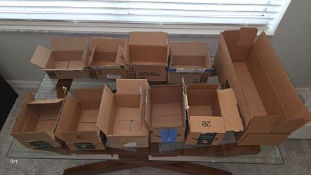 Lot of Used Cardboard Shipping Boxes and packing paper
