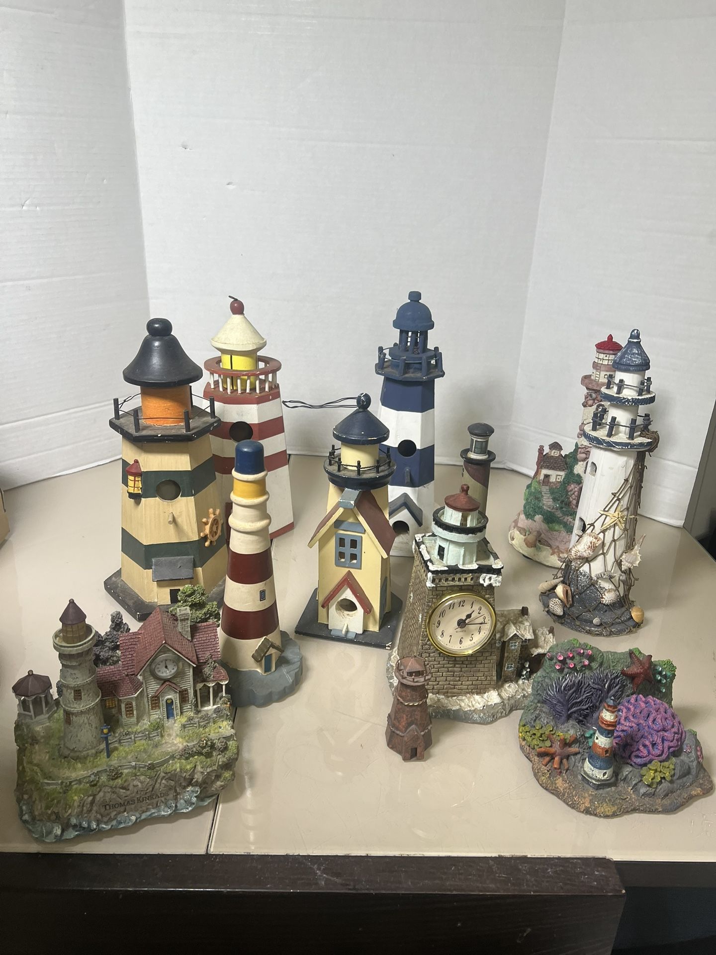 Lot of 12 Misc Lighthouse Figurine Collection Ceramic Wood Handpainted Ocean Sea. READ ! They are all used in general good condition. They will need s