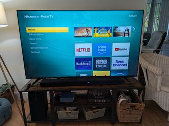 65" 4K Smart TV, LG Soundbar, and Industrial TV Stand