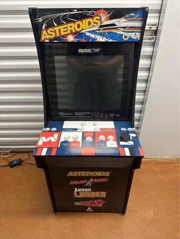 Used Arcade 1Up Asteroids it comes with 4 games on the system(ASTEROIDS, MAJOR HAVOC, LUNAR LANDER)