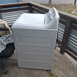 It's A G E Washer Has a slight Dent On The Top  But It Works Perfect